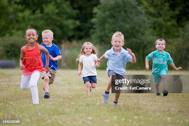 playing tag during recess - playing tag stock pictures, royalty-free photos & images