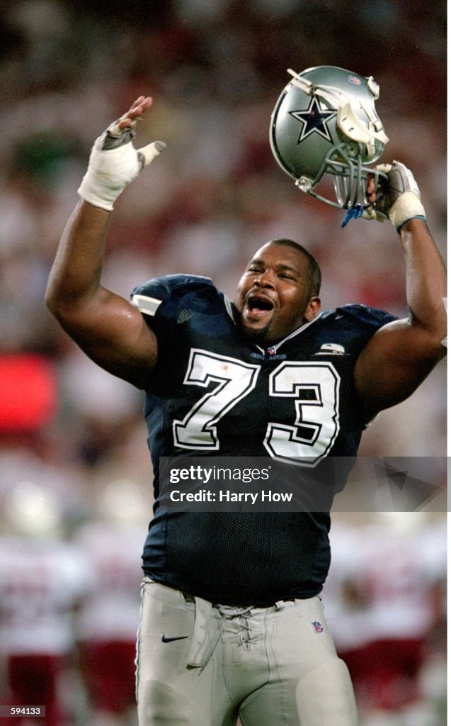 Larry Allen of the Dallas Cowboys reacts on the field during a game ...