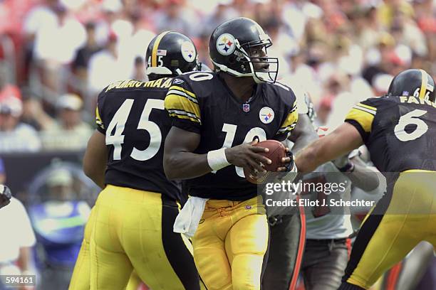 Quarterback Kordell Stewart of the Pittsburgh Steelers drops back to pass behind the blocking of Chris Fuamatu-Ma-''afala and Alan Faneca during the...