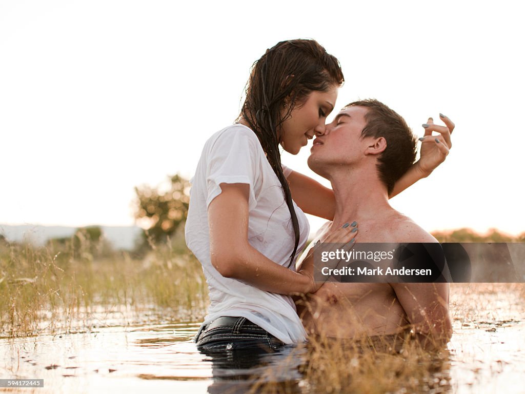USA, Utah, Provo, couple kissing in lake