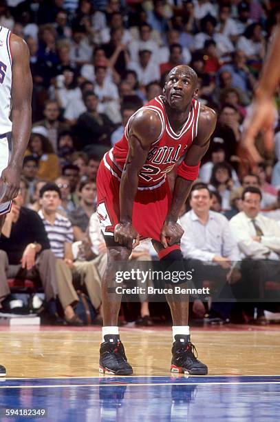 Michael Jordan of the Chicago Bulls looks on as the Philadelphia 76ers shoot free throws during a game in the 1991 Eastern Conference Semifinals in...
