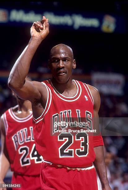 Michael Jordan of the Chicago Bulls stands on the court duing a game in the 1991 Eastern Conference Semifinals against the Philadelphia 76ers in May,...