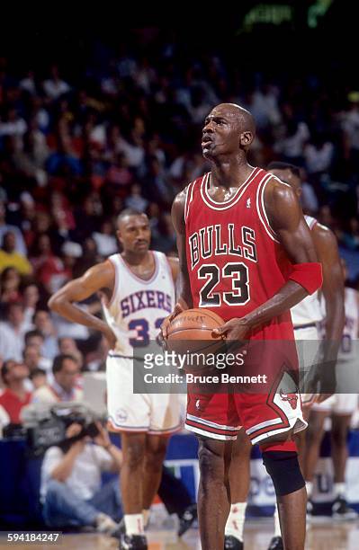 Michael Jordan of the Chicago Bulls shoots a free throw during a game in the 1991 Eastern Conference Semifinals against the Philadelphia 76ers in...