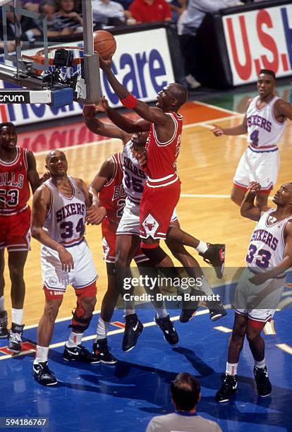 Michael Jordan of the Chicago Bulls goes for the lay-up duing a game in the 1991 Eastern Conference Semifinals against the Philadelphia 76ers in May,...