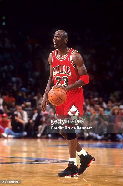 Michael Jordan of the Chicago Bulls dribbles the ball during a game in the 1991 Eastern Conference Semifinals against the Philadelphia 76ers in May,...