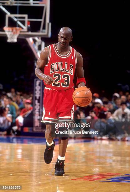 Michael Jordan of the Chicago Bulls dribbles the ball during a game in the 1991 Eastern Conference Semifinals against the Philadelphia 76ers in May,...