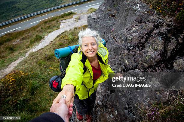 Older woman trekking in the mountains of ireland