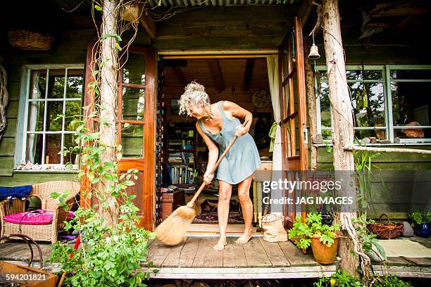 the woman who lives in a log cabin - daily life in ireland stock pictures, royalty-free photos & images