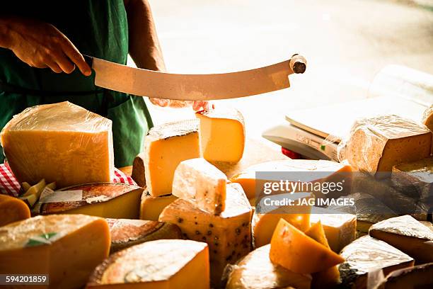 various cheeses on a market stall - dairy product stock-fotos und bilder