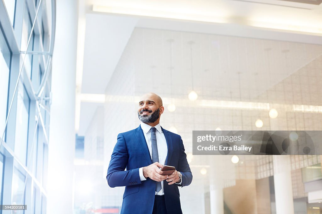 Portrait of a modern businessman in a smart office