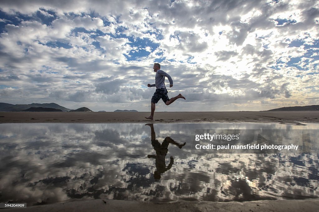 Man running on beach