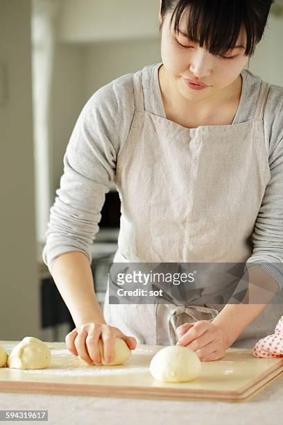 young woman making bread - woman front and back stock-fotos und bilder