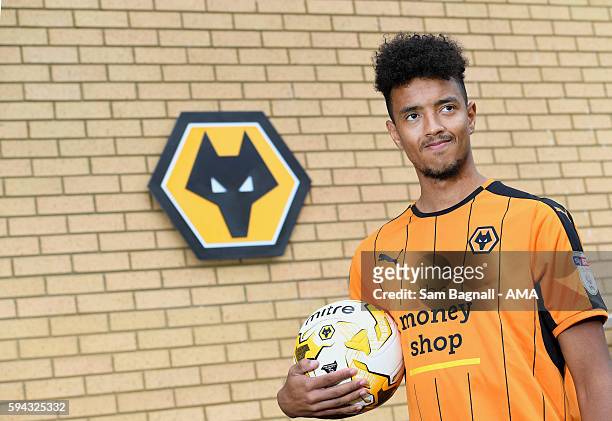 Cameron Borthwick-Jackson of Manchester United signs a season long loan at Wolverhampton Wanderers at Molineux on August 22, 2016 in Wolverhampton,...