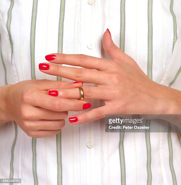 woman getting divorced - wedding rings stock-fotos und bilder
