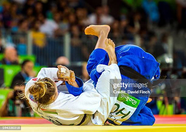 Catherine Beauchemin-Pinard of Canada attempts to arm-lock former junior world champion, Hedvig Karakas of Hungary into submission but eventually...