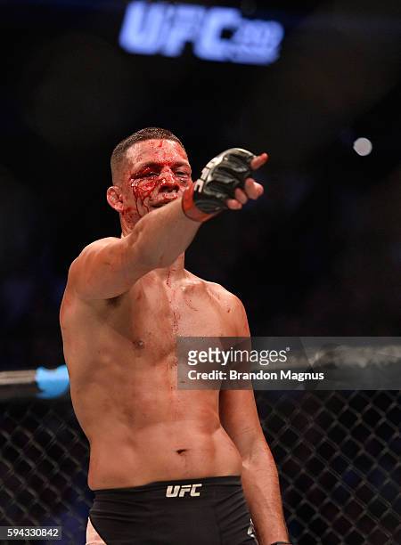 Nate Diaz taunts Conor McGregor in their welterweight bout during the UFC 202 event at T-Mobile Arena on August 20, 2016 in Las Vegas, Nevada.