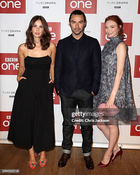 Actor Aidan Turner, actress Heida Reed and actress Eleanor Tomlinson pose for a portrait at the Poldark Series 2 Preview Screening at the BFI on...