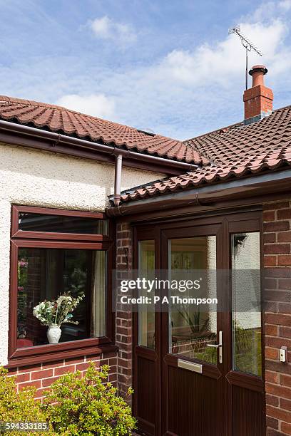 front door and porch of bungalow - bungalow stock pictures, royalty-free photos & images
