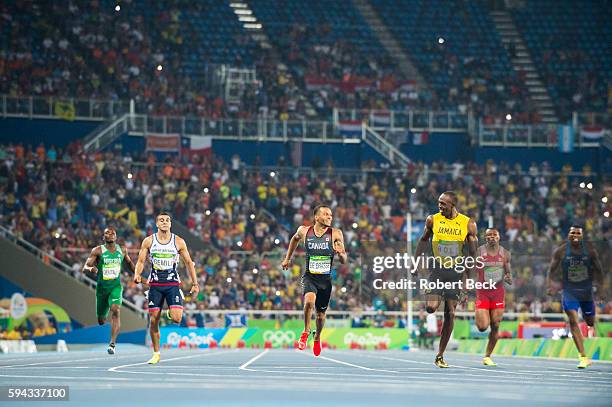 Summer Olympics: Great Britain Adam Gemili, Canada Andre De Grasse, Jamaica Usain Bolt in action, crossing finish line during the Men's 200m...