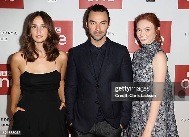 Actor Aidan Turner, actress Heida Reed and actress Eleanor Tomlinson pose for a portrait at the Poldark Series 2 Preview Screening at the BFI on...