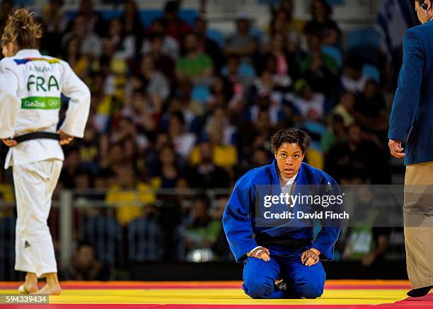 Nekoda Davis of Great Britain pauses for breath after losing her second u57kg contest to three times European champion, Automne Pavia of France,...