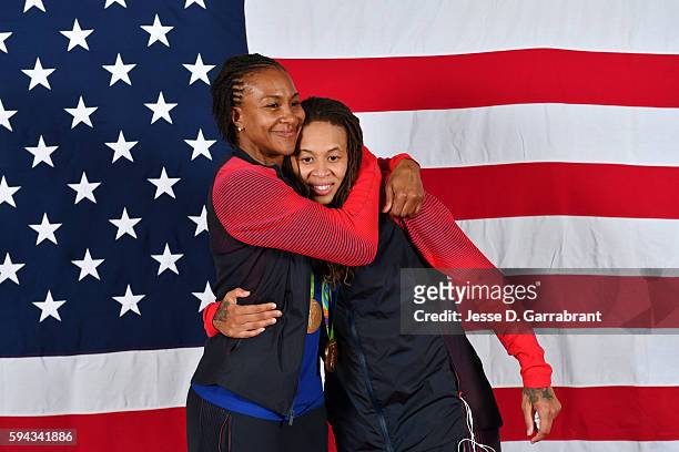 Tamika Catchings and Seimone Augustus of the USA Basketball Women's National Team pose after winning the Gold Medal at the Rio 2016 Olympic games on...