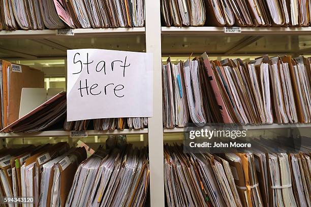 Folders of immigrants' permanent residency applications await processing at the U.S. Citizenship and Immigration Services , Texas Service Center on...