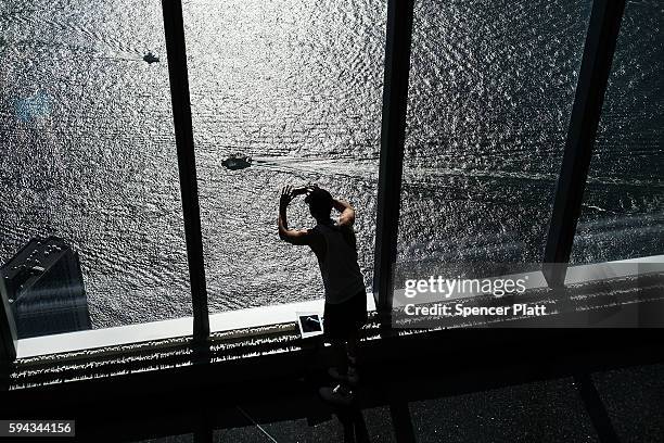 Man takes a photo of the Hudson River from the One World Observatory at One World Trade Center on August 22, 2016 in New York City.The observation...