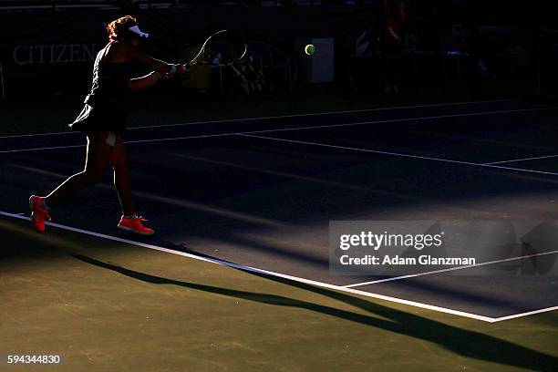 Ana Konjuh of Croatia returns a shot to Kayla Day of the United States during their match on day 2 of the Connecticut Open at the Connecticut Tennis...