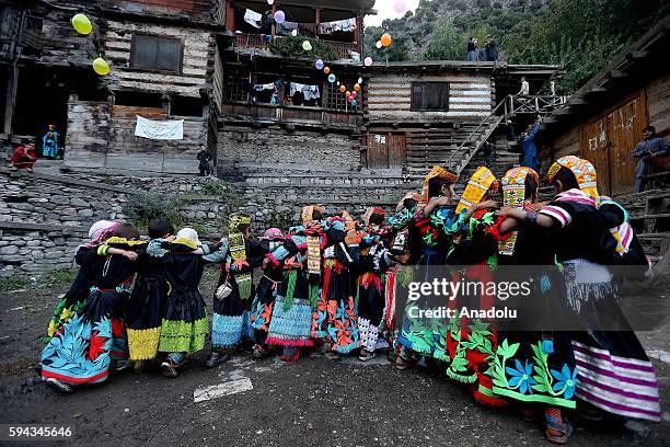 Pakistani Kalash women 'wearing traditional clothes, celebrate 'Uchal' summer festival at Rumbur valley of Chitral town in Khyber Pakhtunkhwa,...