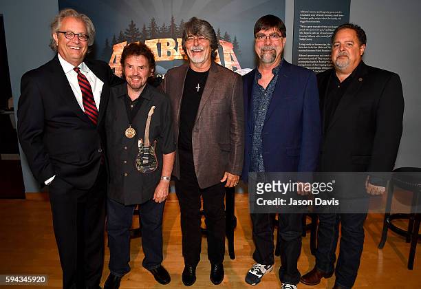 Of Country Music Hall of Fame and Museum Kyle Young, Jeff Cook, Randy Owen, and Teddy Gentry of the band Alabama, and Tony Conway of Conway...