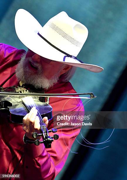 Musician Charlie Daniels performs during the debut of the "Alabama: Song of the South" exhibition at Country Music Hall of Fame and Museum on August...