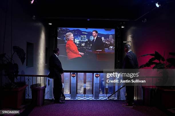 Democratic presidential nominee former Secretary of State Hillary Clinton and Jimmy Kimmel are seen on a monitor as they appear on the set of Jimmy...