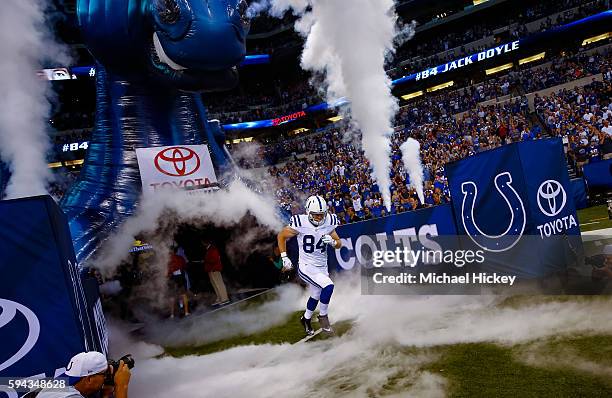 Jack Doyle of the Indianapolis Colts takes the field during player intros before the game against the Baltimore Ravens at Lucas Oil Stadium on August...