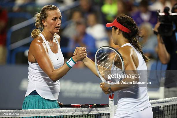 Petra Kvitova of the Czech Republic high fives Louisa Chirico of the United States after Kvitova's victory on day 2 of the Connecticut Open at the...