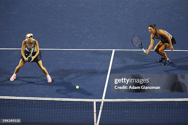 Caroline Wozniacki of Denmark and Klaudia Jans-Ignacik of Poland during their doubles match against Timea Babos of Hungary and Yaroslava Shvedova of...