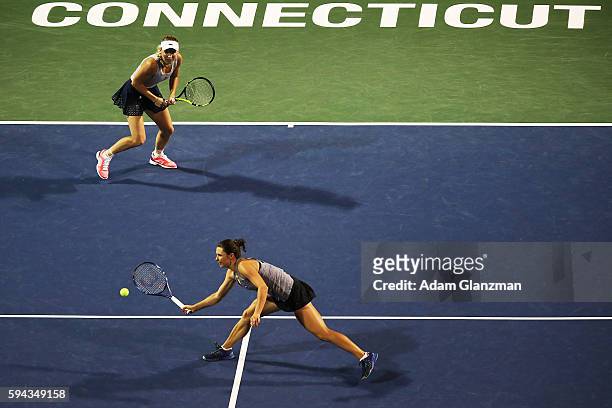 Caroline Wozniacki of Denmark and Klaudia Jans-Ignacik of Poland during their doubles match against Timea Babos of Hungary and Yaroslava Shvedova of...