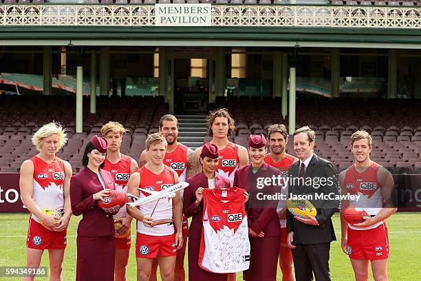 Swans players and Qatar Airways staff poses for the media during a Sydney Swans AFL media announcement at Sydney Cricket Ground on August 23, 2016 in...