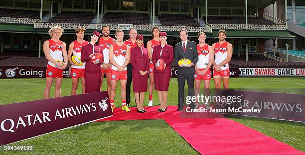 Swans players and Qatar Airways staff poses for the media during a Sydney Swans AFL media announcement at Sydney Cricket Ground on August 23, 2016 in...