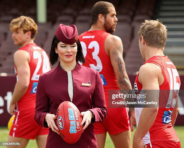 Qatar Airways flight attendant watches on during a Sydney Swans AFL media announcement at Sydney Cricket Ground on August 23, 2016 in Sydney,...