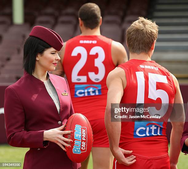 Qatar Airways flight attendant watches on during a Sydney Swans AFL media announcement at Sydney Cricket Ground on August 23, 2016 in Sydney,...