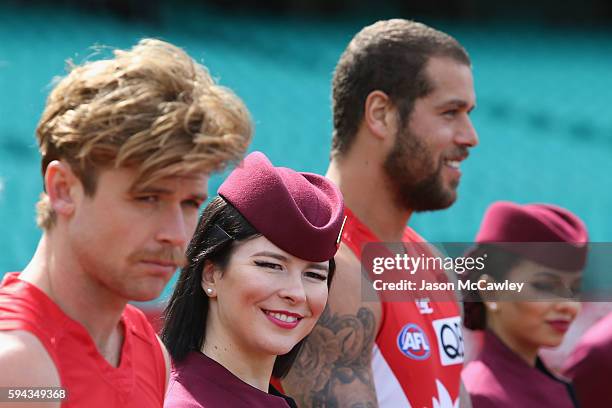 Qatar Airways flight attendant watches on during a Sydney Swans AFL media announcement at Sydney Cricket Ground on August 23, 2016 in Sydney,...