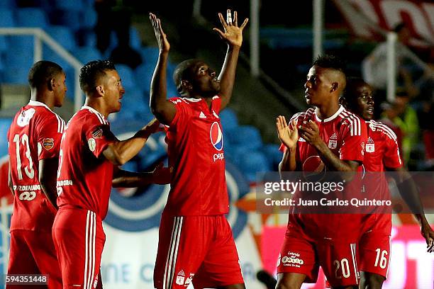 Cristian Martinez Borja of America de Cali celebrates with teammates after scoring the opening goal during a match between America de Cali and...