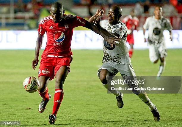 Cristian Martinez Borja of America de Cali and Jair Benitez of Atletico FC struggles for the ball during a match between America de Cali and Atletico...