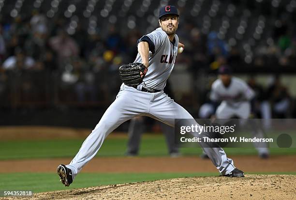 Andrew Miller of the Cleveland Indians pitches against the Oakland Athletics in the bottom of the ninth inning at the Oakland Coliseum on August 22,...