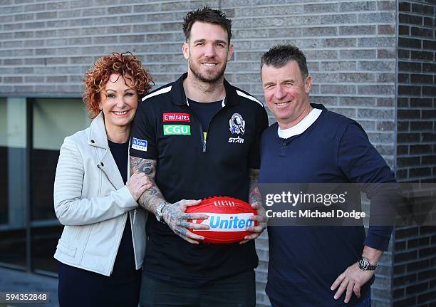 Retiring Dane Swan of the Magpies poses with mum Deidre Swan and dad Billy Swan during a Collingwood Magpies AFL media session at the Holden Centre...