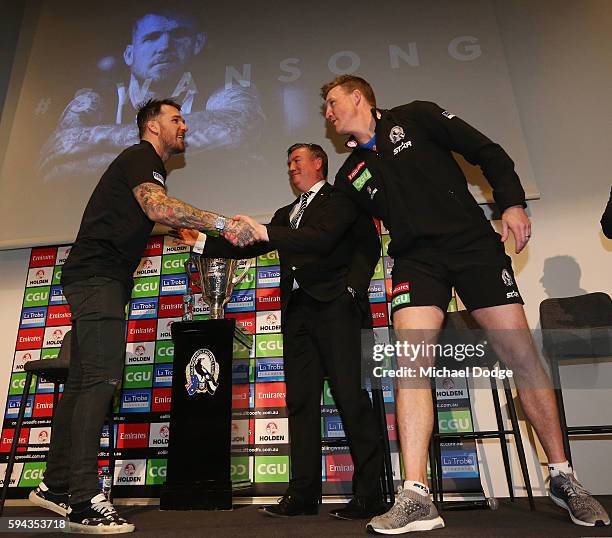 Retiring Dane Swan of the Magpies shakes hands with Magpies President Eddie Maguire and head coach Nathan Buckley during a Collingwood Magpies AFL...