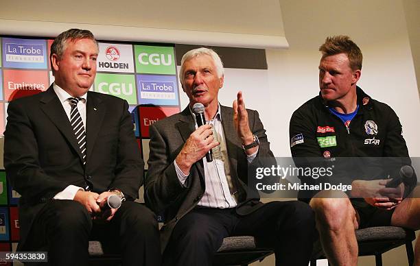Magpies President Eddie Maguire, former head coach Mick Malthouse and current head coach Nathan Buckley pay tribute to retiring Dane Swan during a...