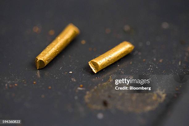 Pieces of gold sit at the Baird & Co. Ltd. Precious metals refinery in London, U.K., on Wednesday, Aug. 3, 2016. Baird & Co., which buys much of the...