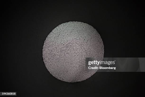 Silver grain sits in a bin as it cools down after being melted down at the Baird & Co. Ltd. Precious metals refinery in London, U.K., on Wednesday,...